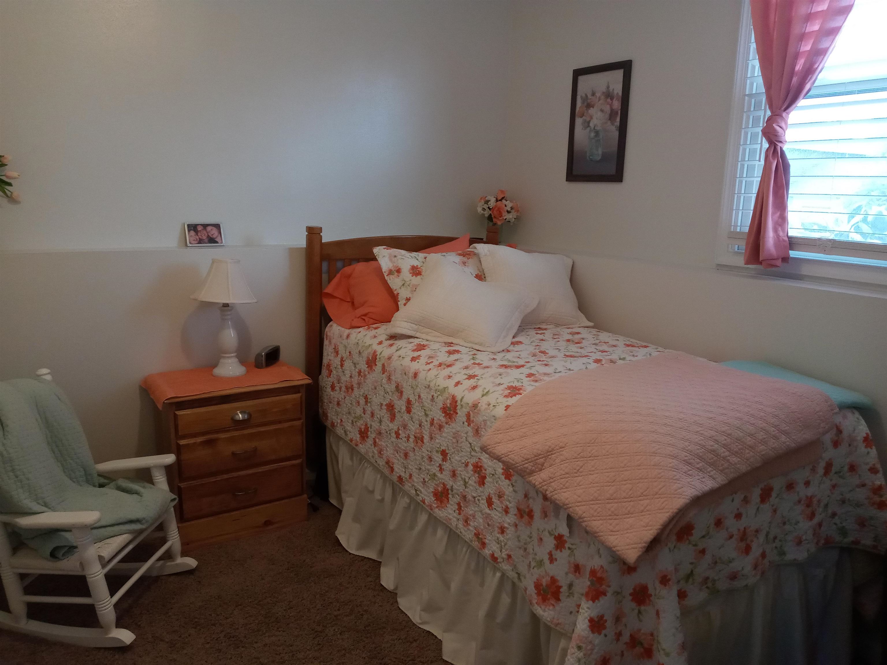 207 Westfield Road Winnebago, IL 61088 - Photo 24 of 27 a bedroom with a bed and a window