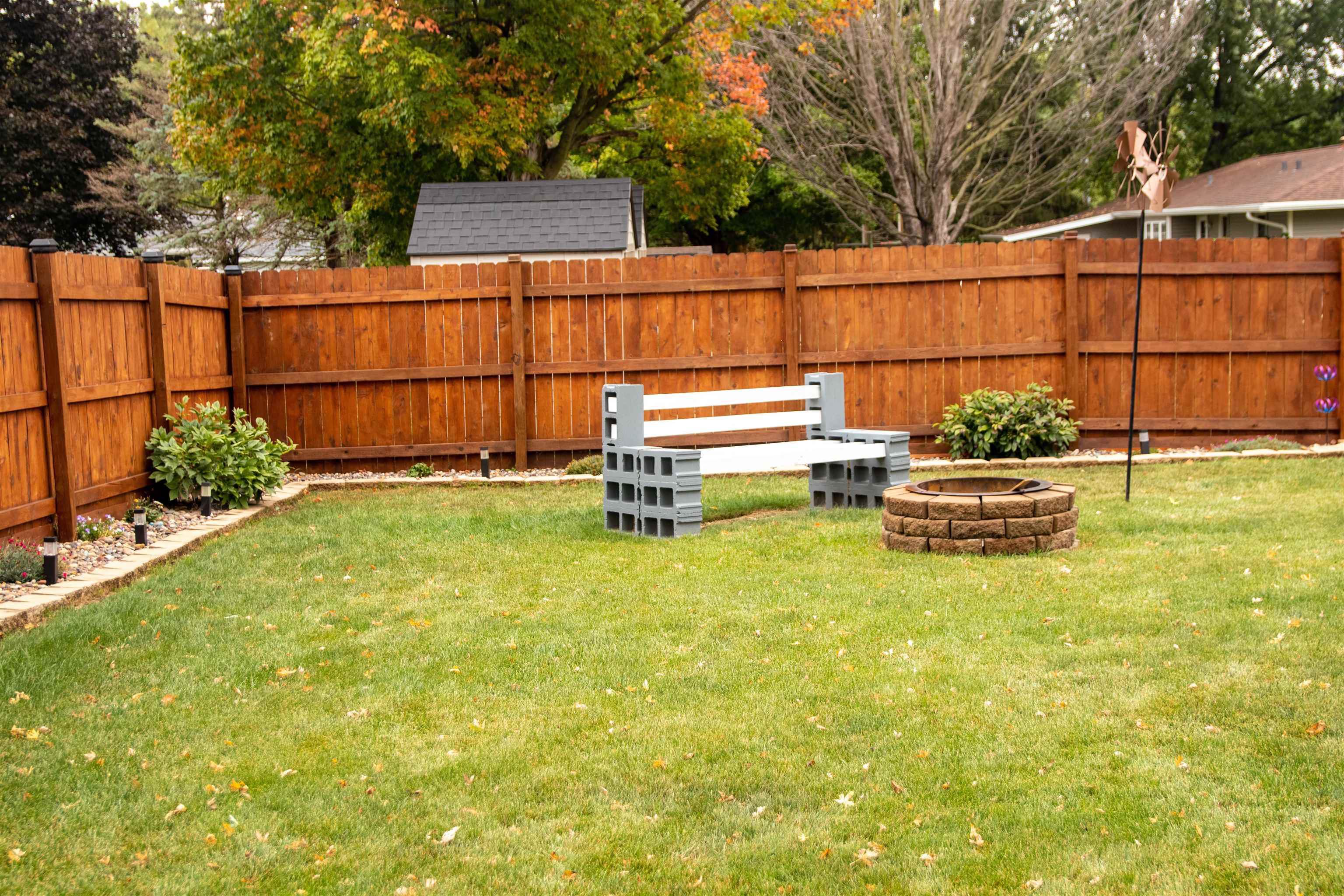 207 Westfield Road Winnebago, IL 61088 - Photo 5 of 27 a backyard of a house with yard and outdoor seating