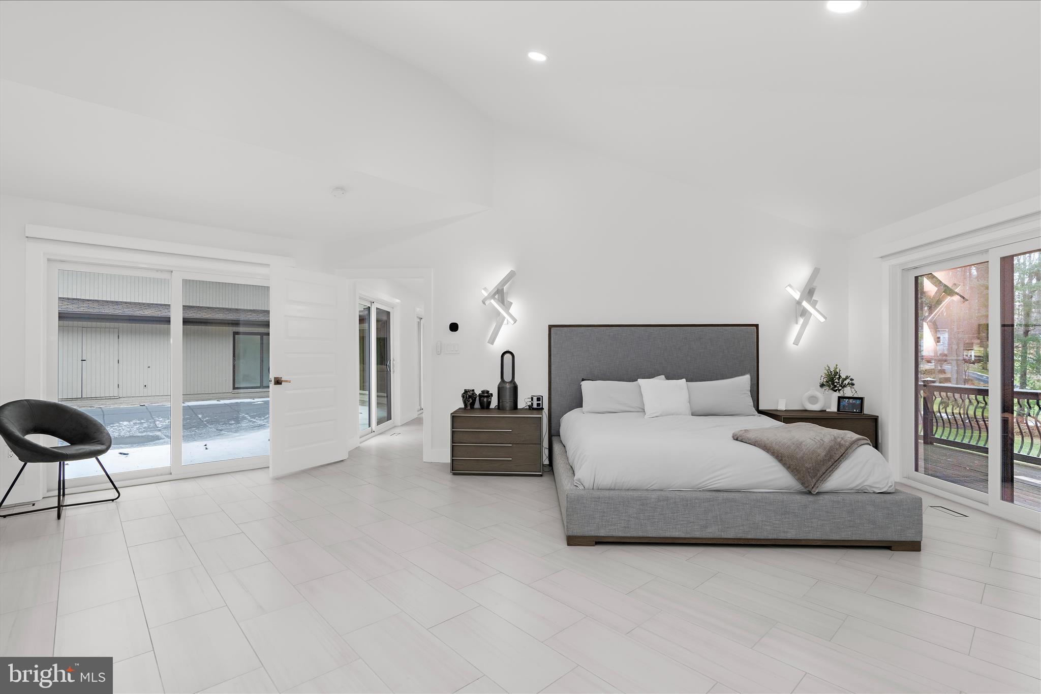 2308 Caves Road Owings Mills, MD 21117 - Photo 18 of 70 a spacious bedroom with a bed and a couch