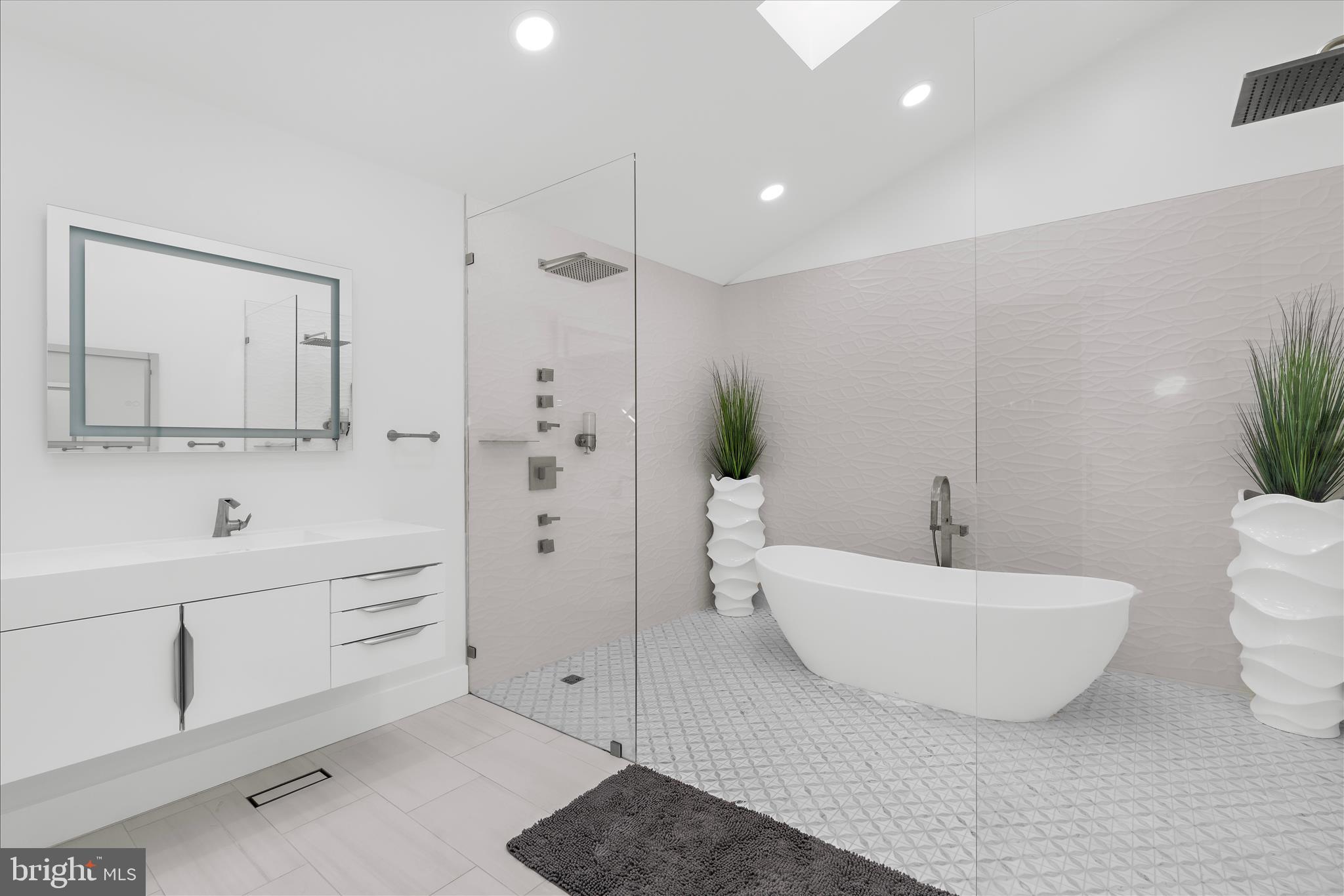 2308 Caves Road Owings Mills, MD 21117 - Photo 21 of 70 a bathroom with a double vanity sink mirror and bathtub