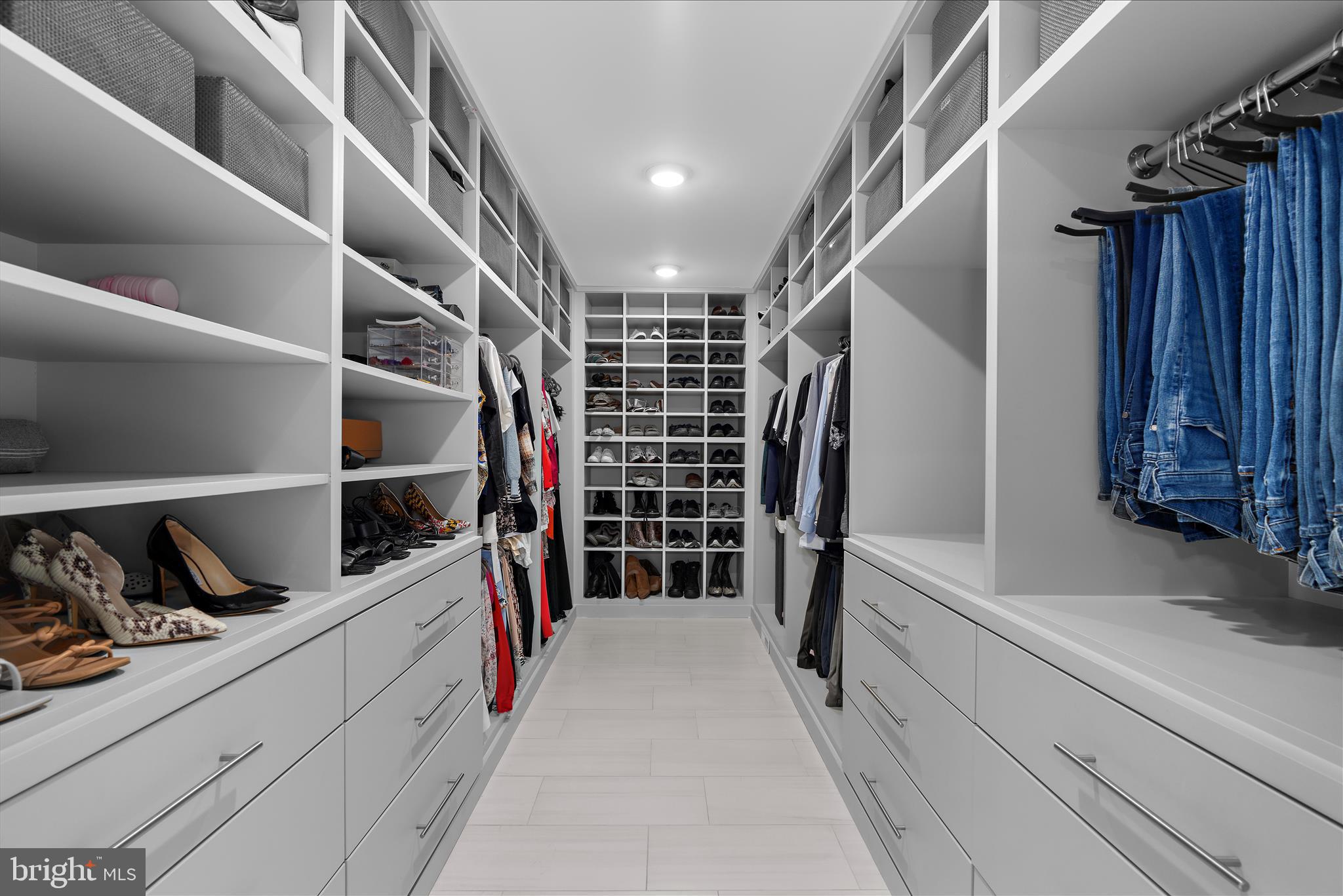 2308 Caves Road Owings Mills, MD 21117 - Photo 22 of 70 a view of walk in closet with clothes and shoes