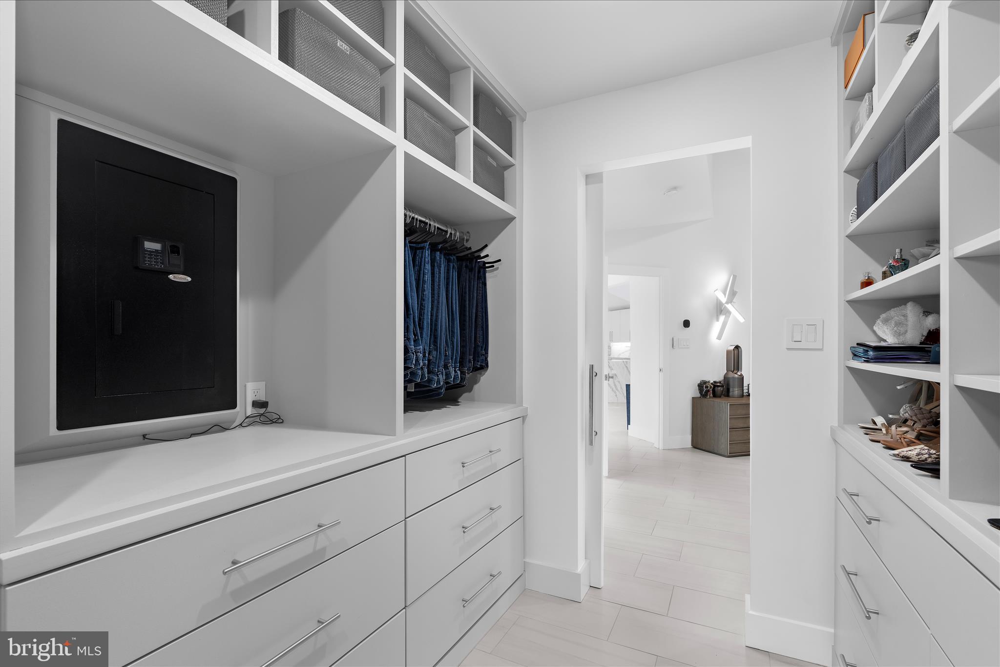 2308 Caves Road Owings Mills, MD 21117 - Photo 23 of 70 a hallway with cabinets and a wooden floors