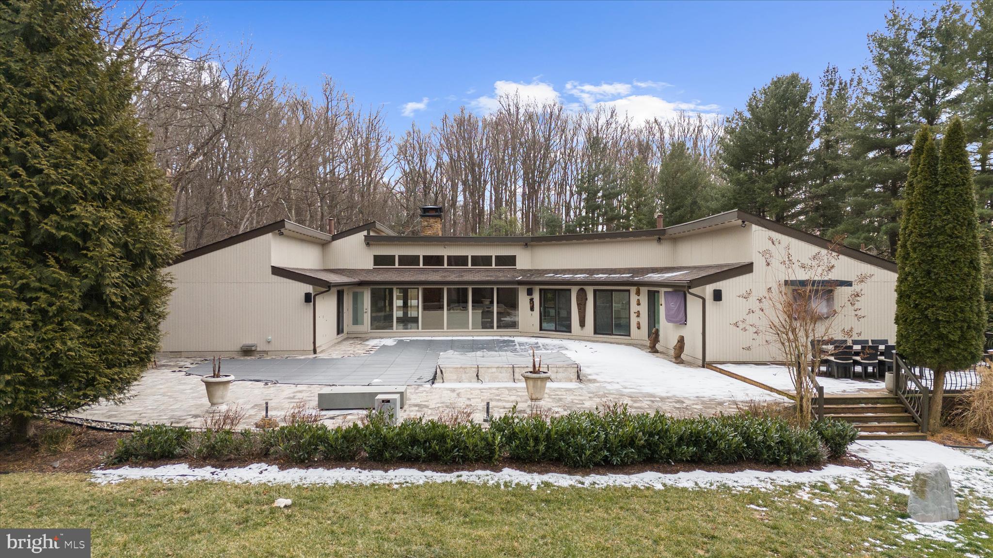 2308 Caves Road Owings Mills, MD 21117 - Photo 36 of 70 a front view of a house with a yard swimming pool and outdoor seating