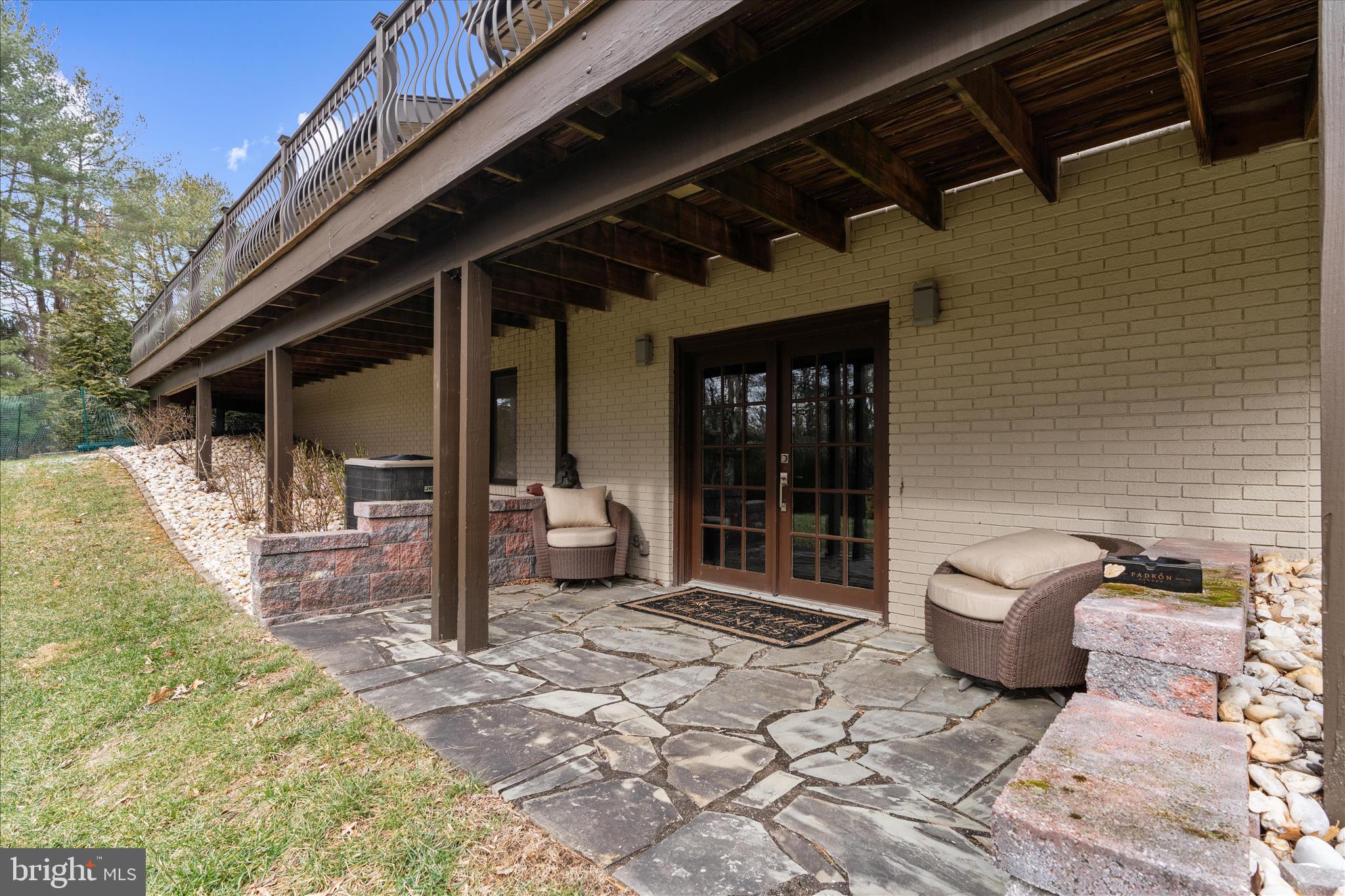 2308 Caves Road Owings Mills, MD 21117 - Photo 62 of 70 a view of a chair and fire pit in backyard of the house