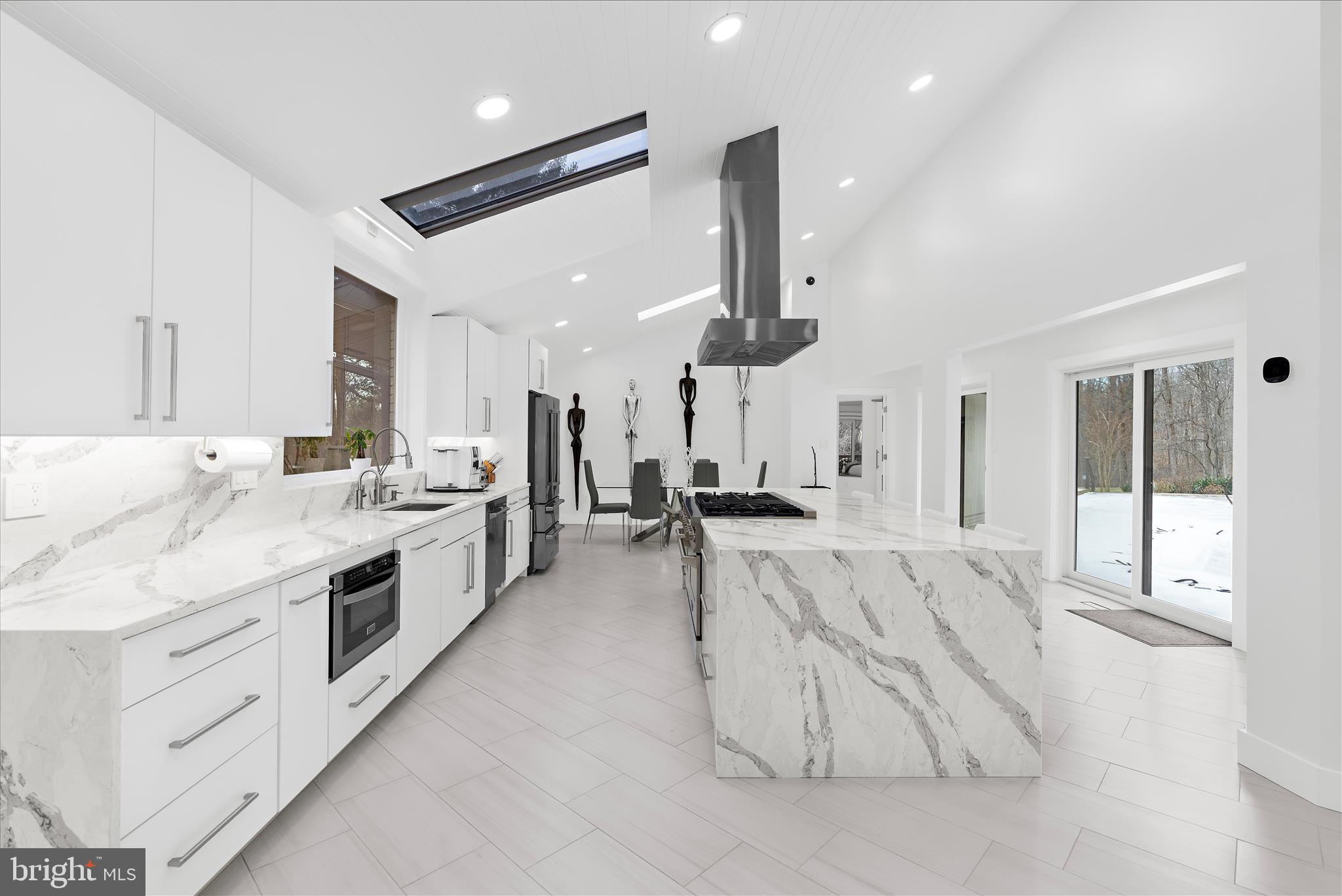 2308 Caves Road Owings Mills, MD 21117 - Photo 7 of 70 a large white kitchen with a large window