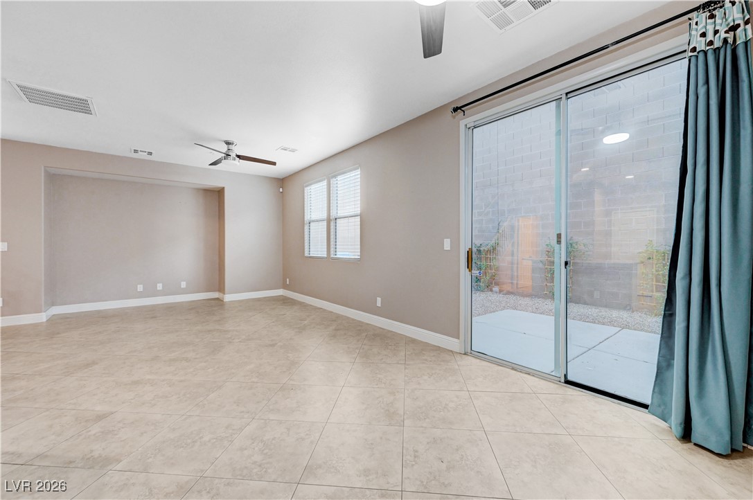 645 Monument Point Street Henderson, NV 89002 - Photo 13 of 54 Spare room featuring a ceiling fan and light tile patterned flooring