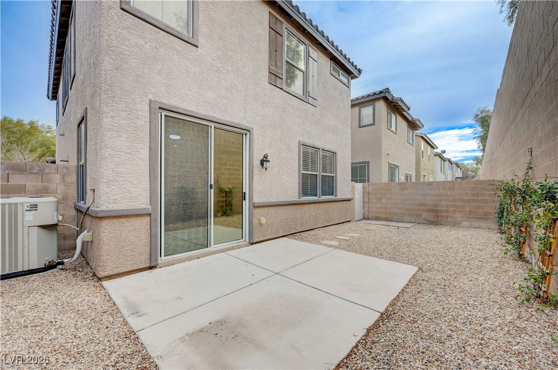 645 Monument Point Street Henderson, NV 89002 - Photo 45 of 54 Back of property featuring a patio area, a tiled roof, a fenced backyard, and stucco siding