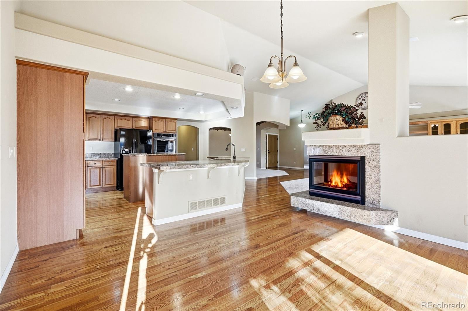10482 Grizzly Gulch Highlands Ranch, CO 80129 - Photo 17 of 50 a view of a kitchen and an empty room
