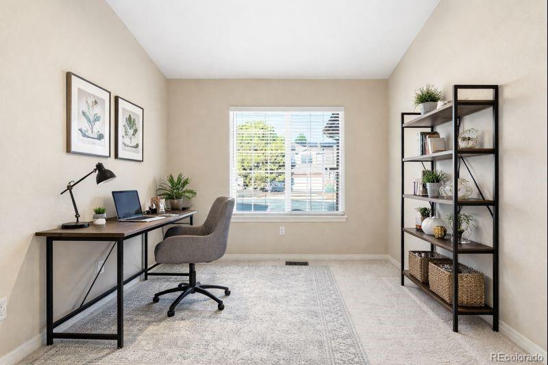 10482 Grizzly Gulch Highlands Ranch, CO 80129 - Photo 21 of 50 a view of a workspace with furniture and a window
