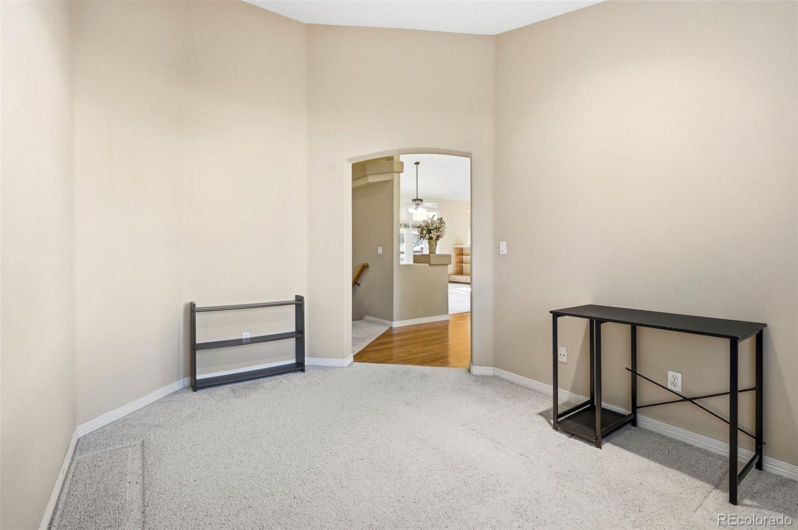 10482 Grizzly Gulch Highlands Ranch, CO 80129 - Photo 22 of 50 a view of a room with a bench