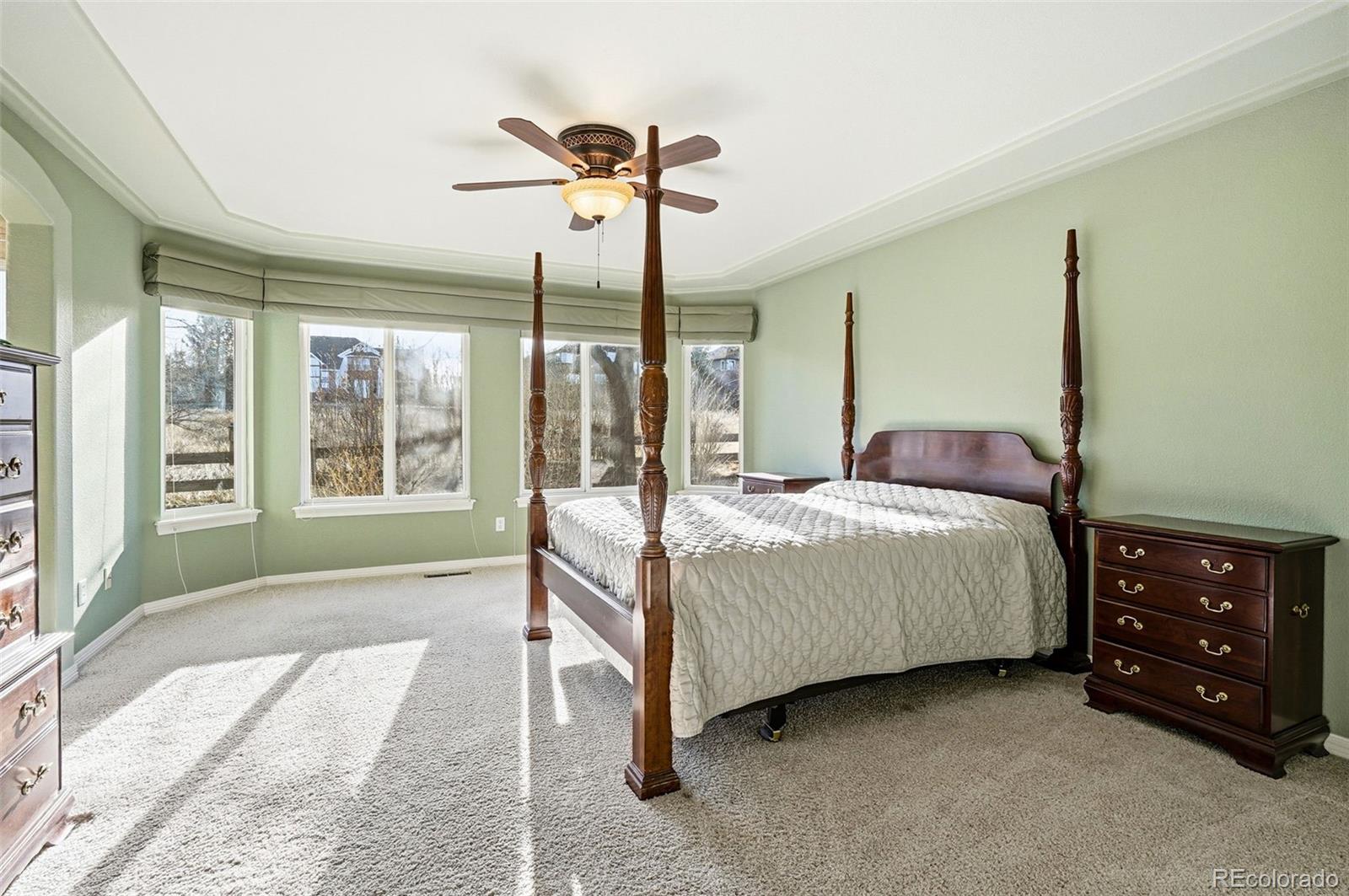 10482 Grizzly Gulch Highlands Ranch, CO 80129 - Photo 24 of 50 a bedroom with a bed dresser and a window