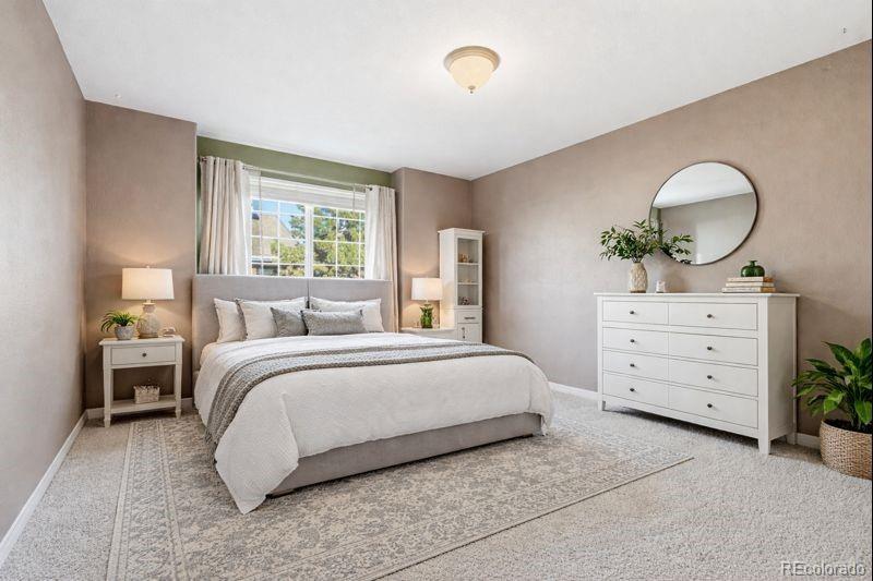 10482 Grizzly Gulch Highlands Ranch, CO 80129 - Photo 34 of 50 a bedroom with a bed and a dresser