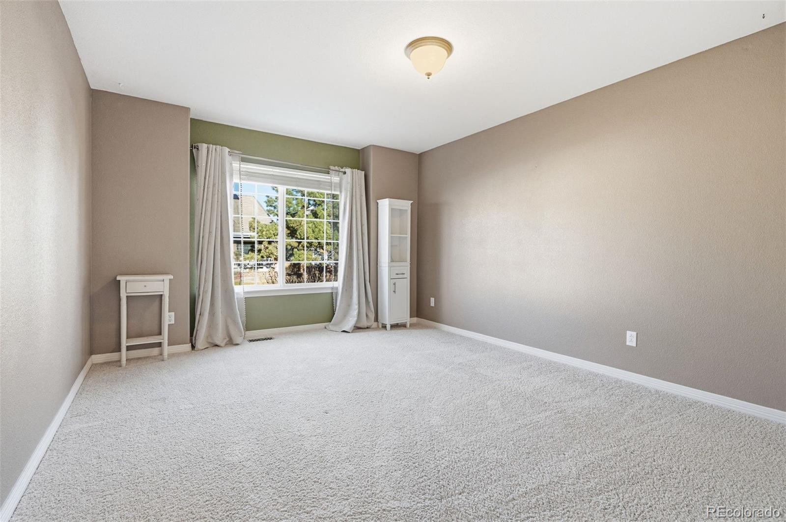 10482 Grizzly Gulch Highlands Ranch, CO 80129 - Photo 35 of 50 a view of an empty room with a window