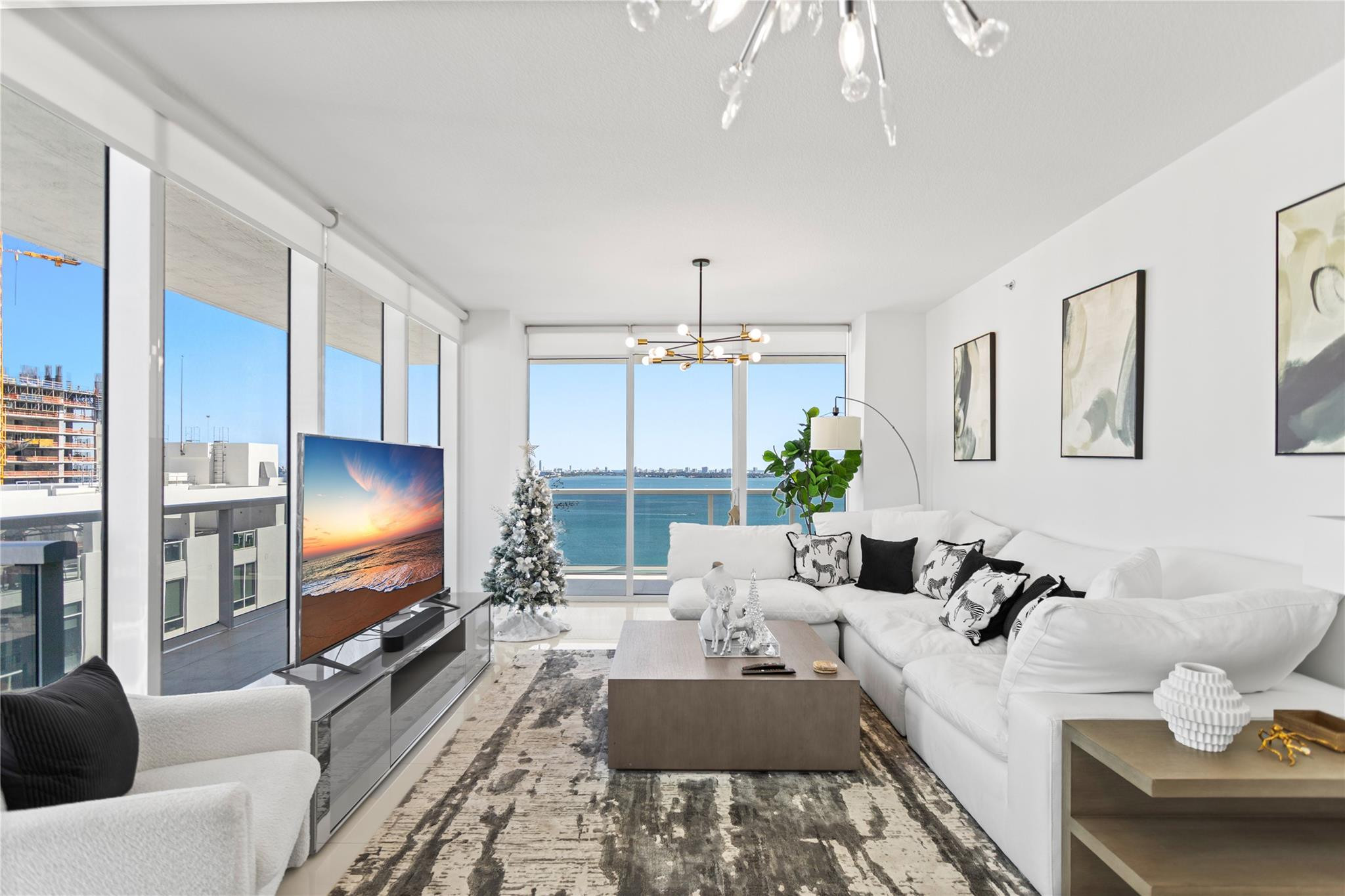 600 Northeast 27th Street, Unit 2301 Miami, FL 33137 - Photo 13 of 77 a living room with furniture and a flat screen tv