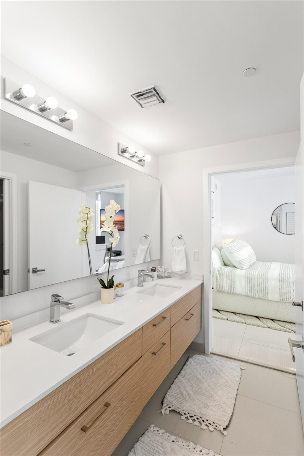 600 Northeast 27th Street, Unit 2301 Miami, FL 33137 - Photo 19 of 77 a bathroom with a double vanity sink mirror and