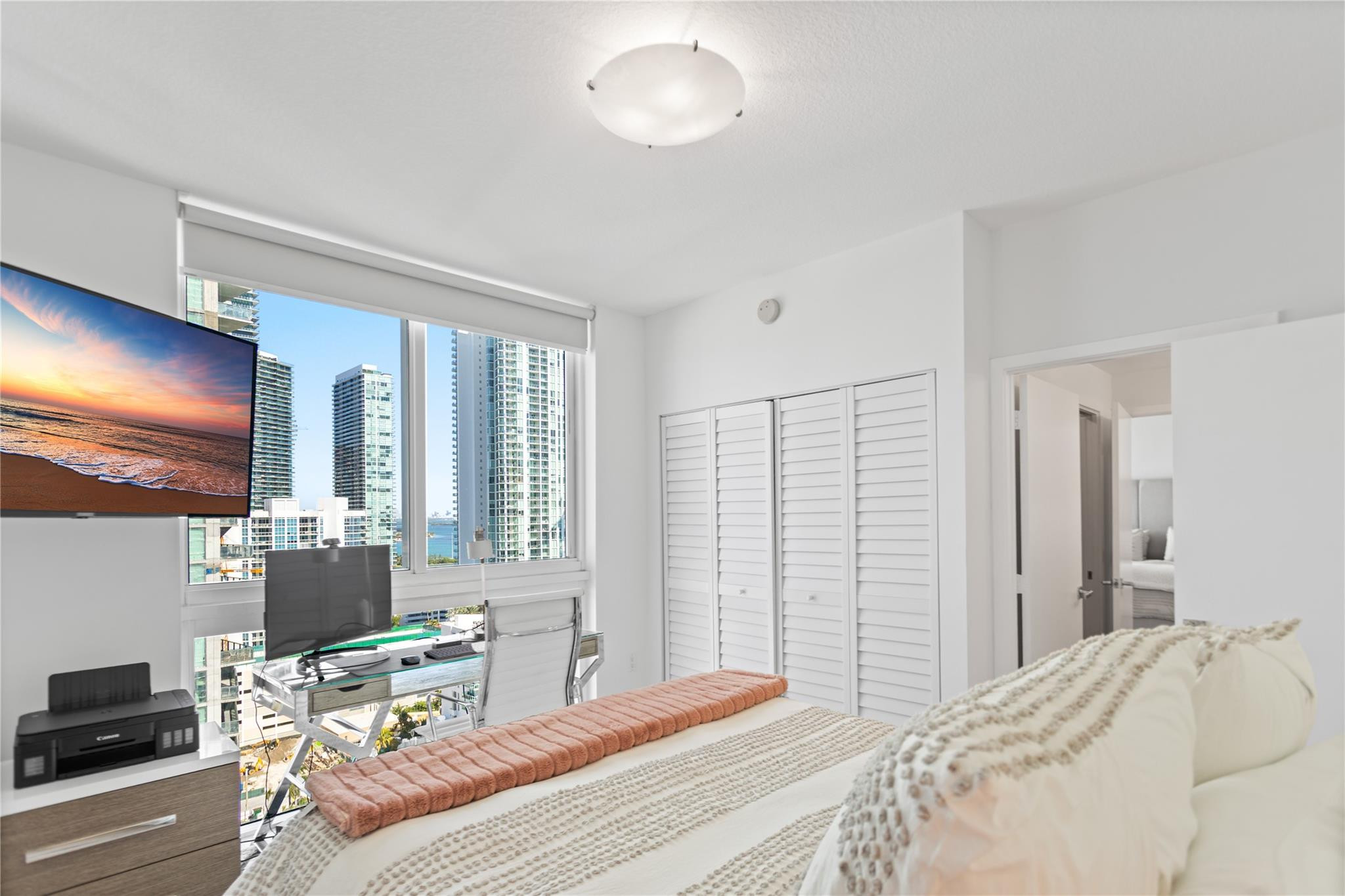 600 Northeast 27th Street, Unit 2301 Miami, FL 33137 - Photo 24 of 77 a bedroom with a bed and glass window