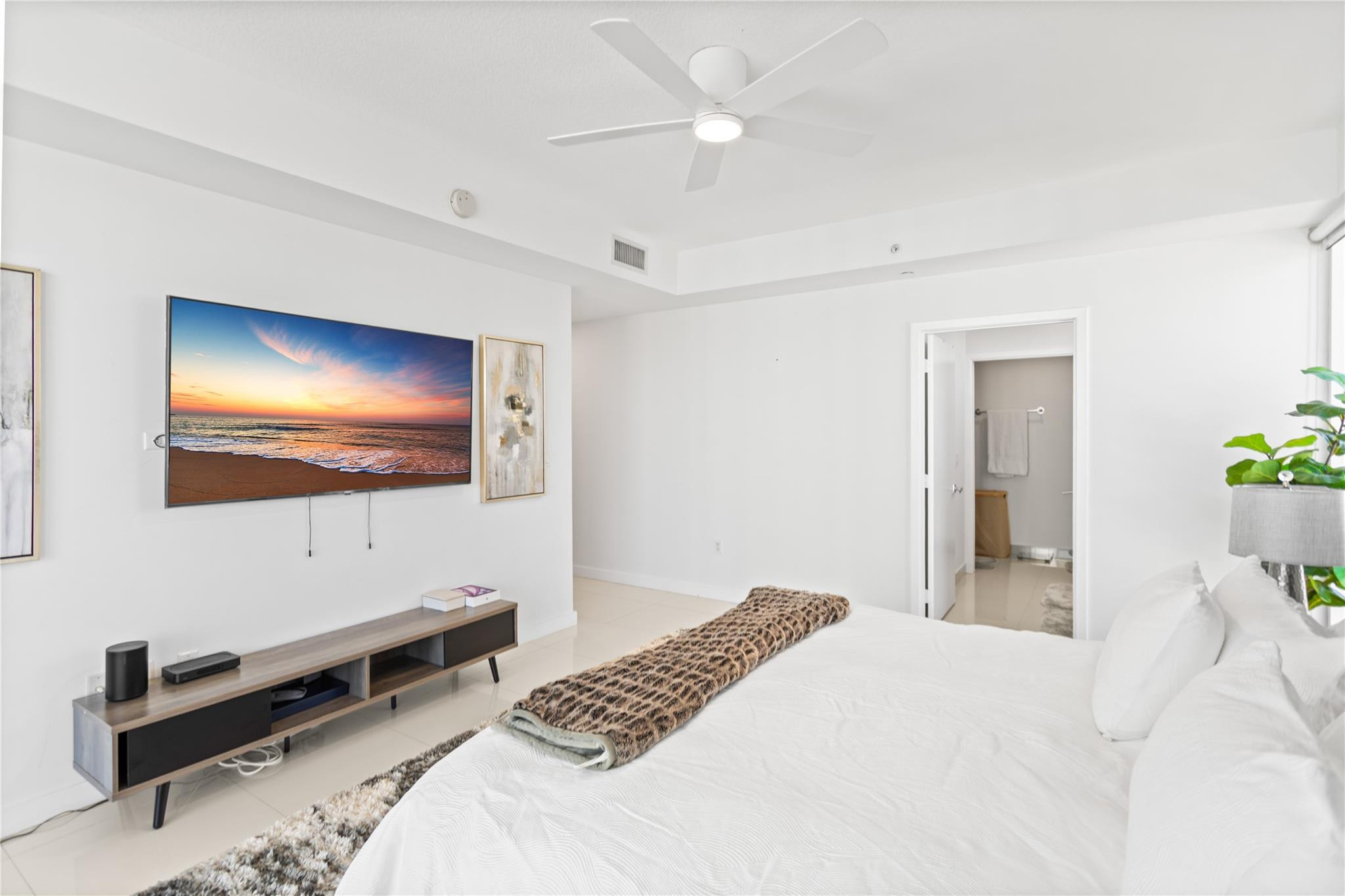 600 Northeast 27th Street, Unit 2301 Miami, FL 33137 - Photo 29 of 77 a bedroom with a bed and a flat screen tv