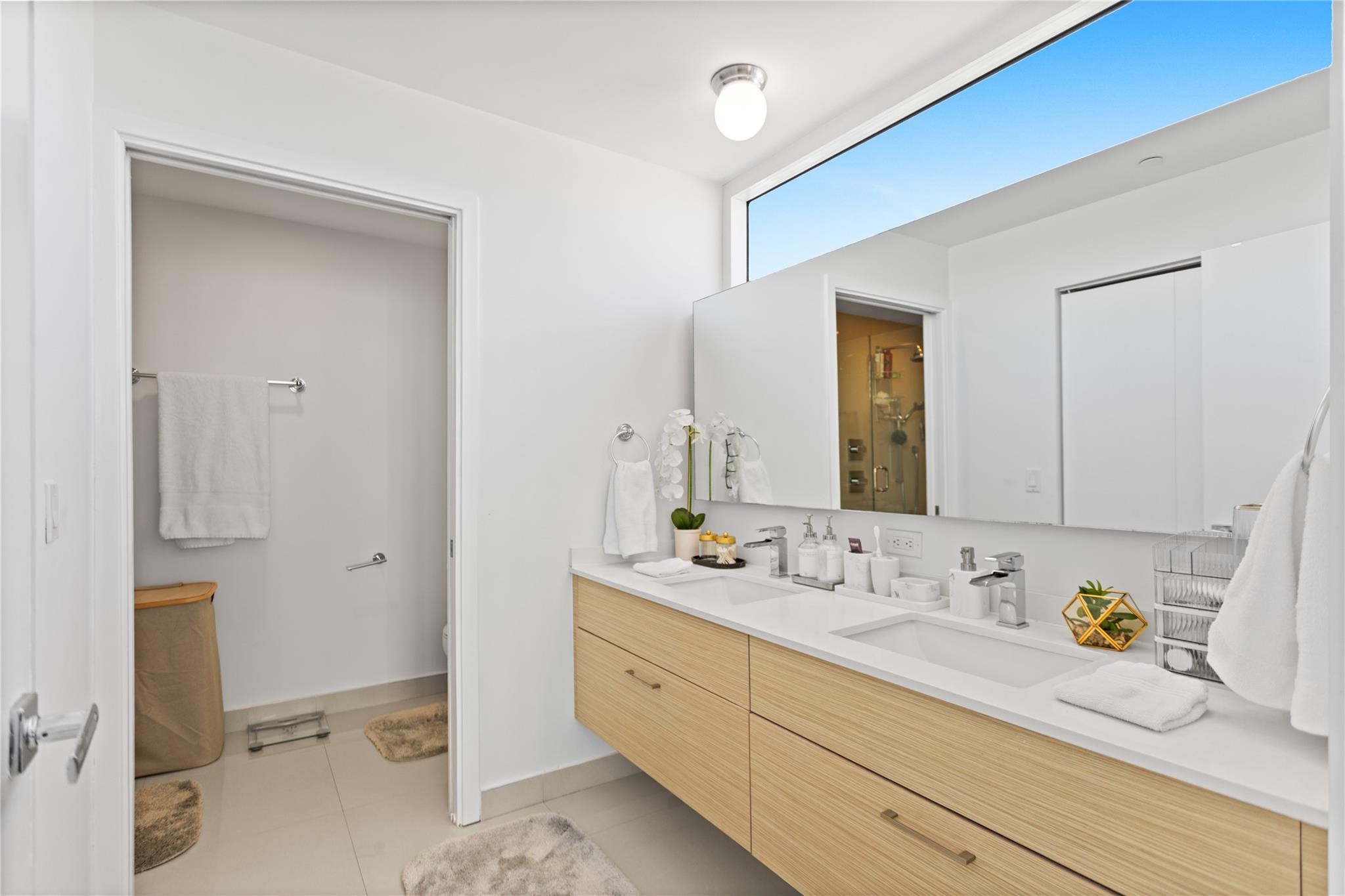 600 Northeast 27th Street, Unit 2301 Miami, FL 33137 - Photo 38 of 77 a bathroom with a granite countertop sink mirror and double