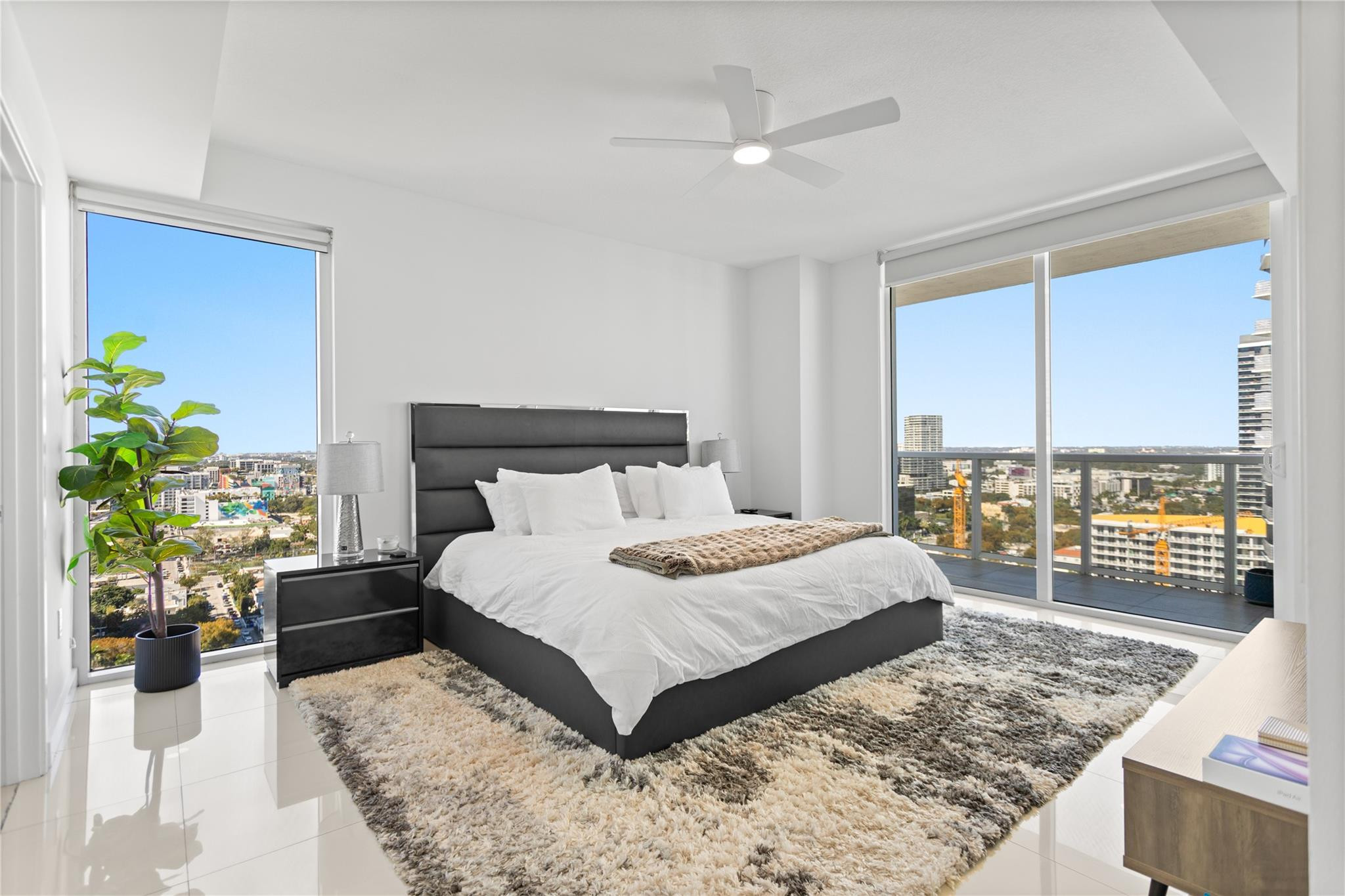 600 Northeast 27th Street, Unit 2301 Miami, FL 33137 - Photo 41 of 77 a bedroom with a large bed and a couch