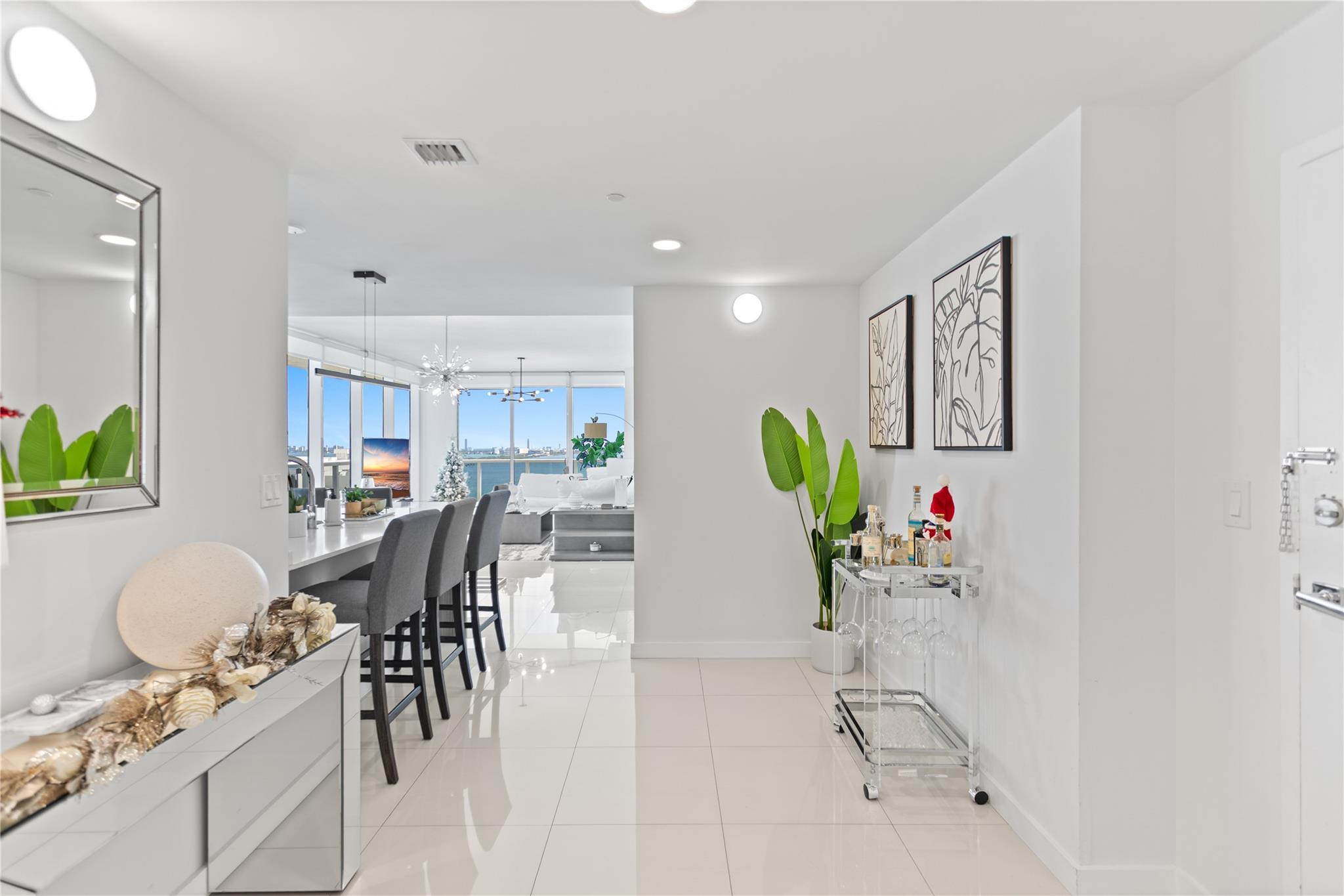 600 Northeast 27th Street, Unit 2301 Miami, FL 33137 - Photo 53 of 77 a dining room with furniture and a floor to ceiling window