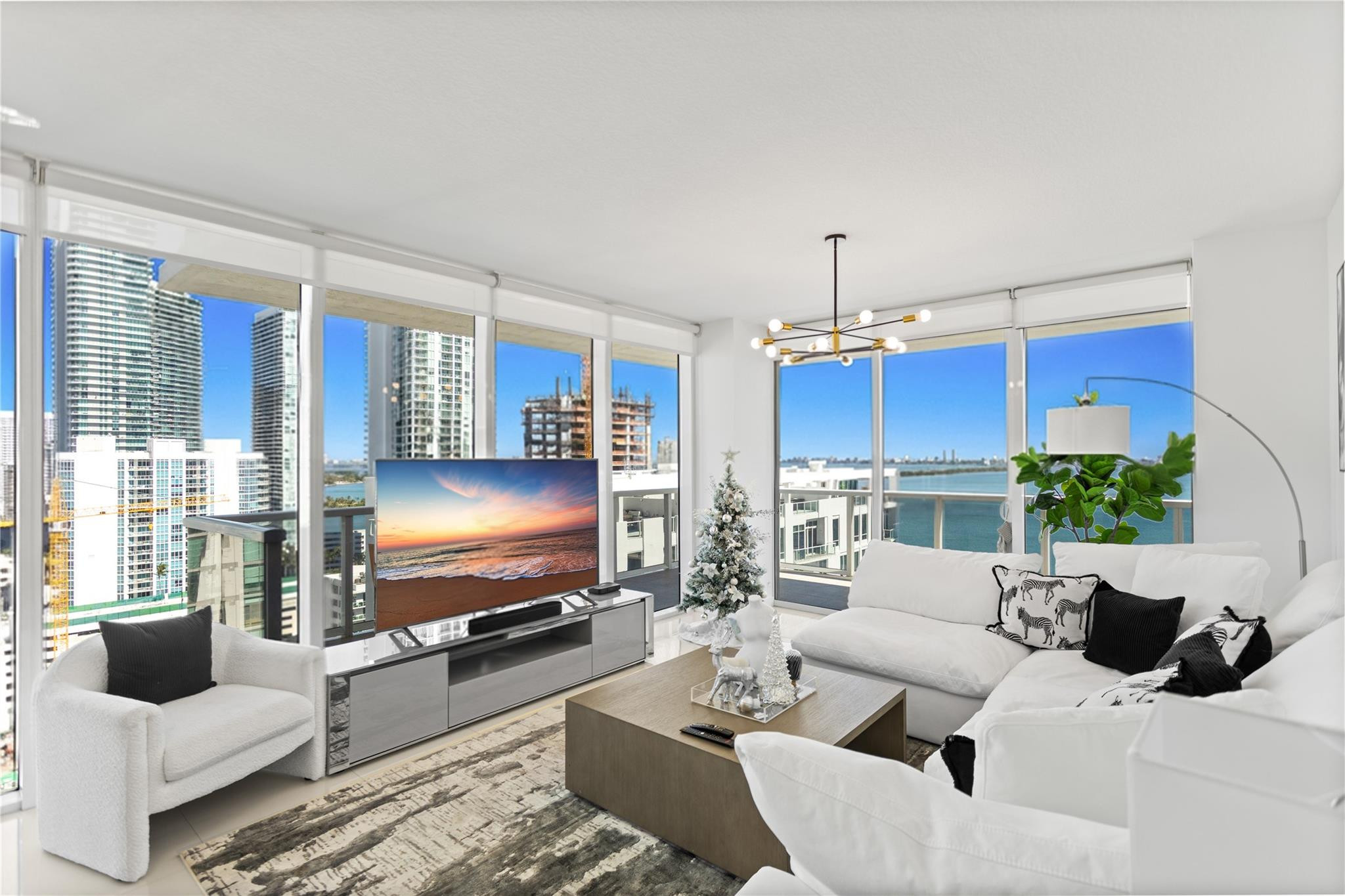 600 Northeast 27th Street, Unit 2301 Miami, FL 33137 - Photo 75 of 77 a living room with furniture and a flat screen tv