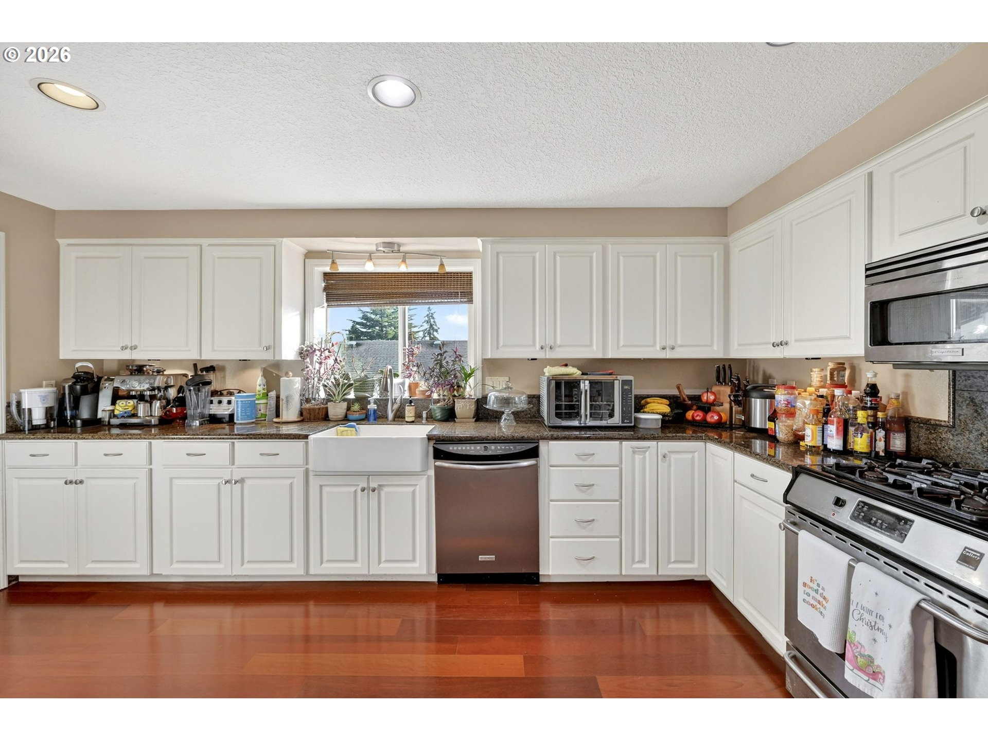 2445 Debok Road West Linn, OR 97068 - Photo 15 of 45 a kitchen with a white cabinets and window