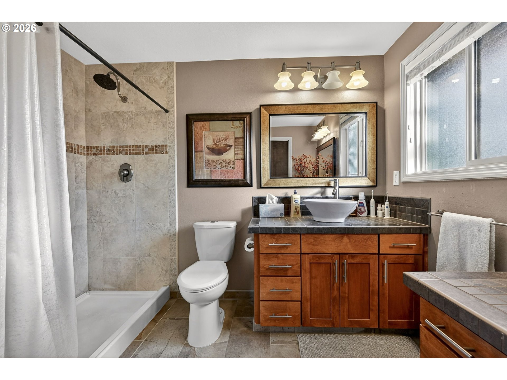 2445 Debok Road West Linn, OR 97068 - Photo 18 of 45 a bathroom with a sink a toilet and a mirror