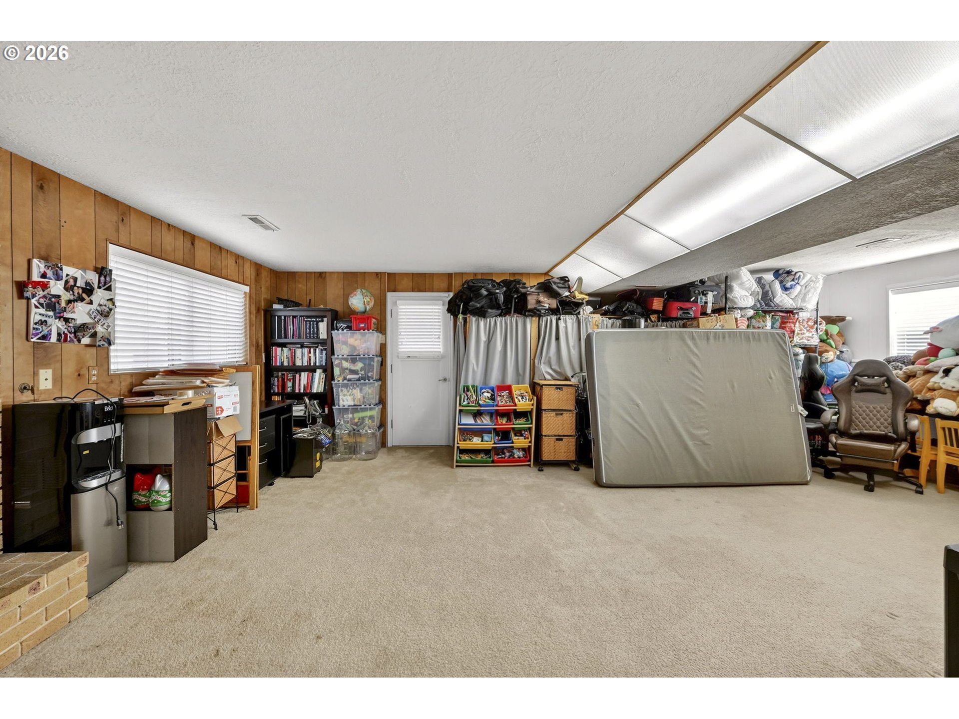 2445 Debok Road West Linn, OR 97068 - Photo 23 of 45 a view of a livingroom with furniture and a garage