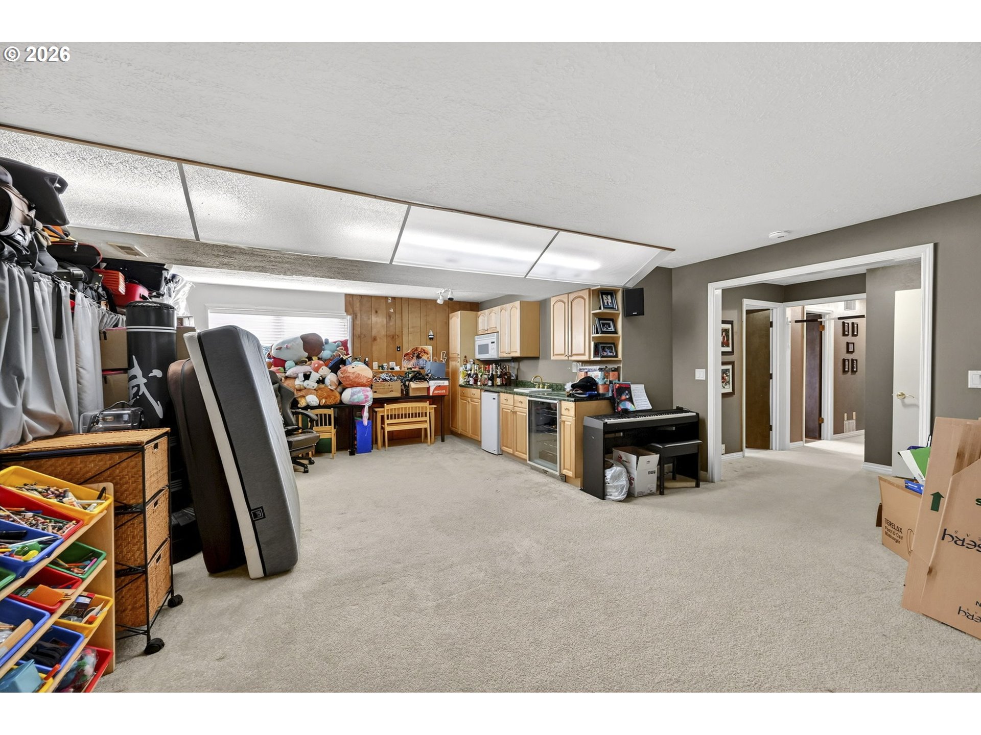 2445 Debok Road West Linn, OR 97068 - Photo 24 of 45 a living room with lots of furniture and a flat screen tv
