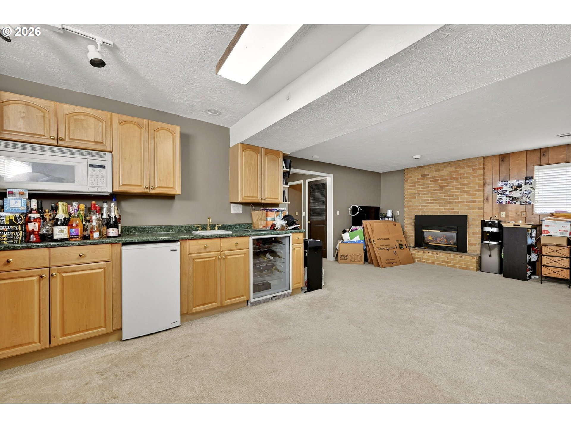 2445 Debok Road West Linn, OR 97068 - Photo 26 of 45 a large white kitchen with stainless steel appliances granite countertop a stove and a sink