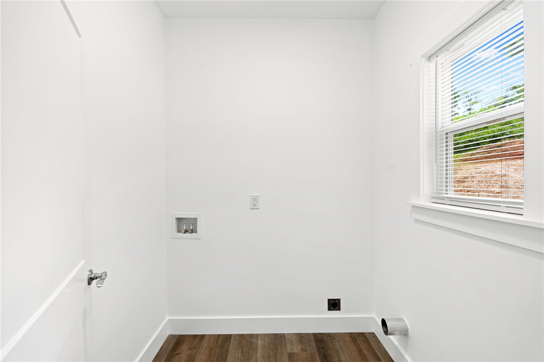 914 Smith Grove Road Easley, SC 29640 - Photo 15 of 37 A dedicated laundry room with hookups and rich wood flooring awaits your appliances.