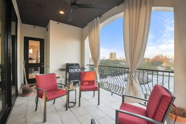 a balcony with chairs and with furniture
