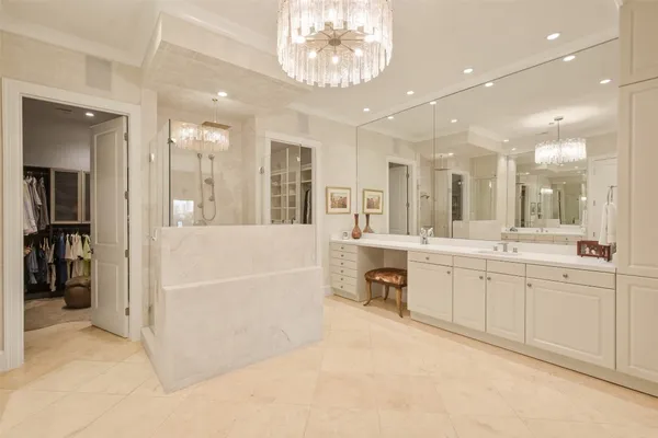 a large spacious bathroom with a large tub shower and sink