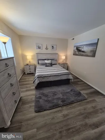 a spacious bedroom with a bed and a window
