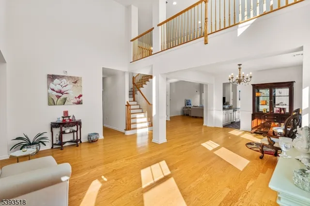 a view of a livingroom with furniture and a bedroom