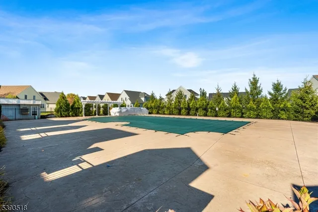 a view of street with houses and trees in the background