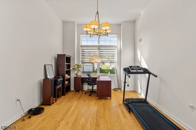 a dining room with furniture and a window