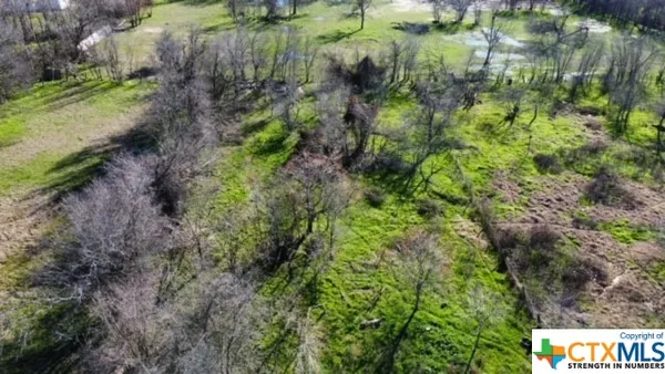 a view of a garden with a house