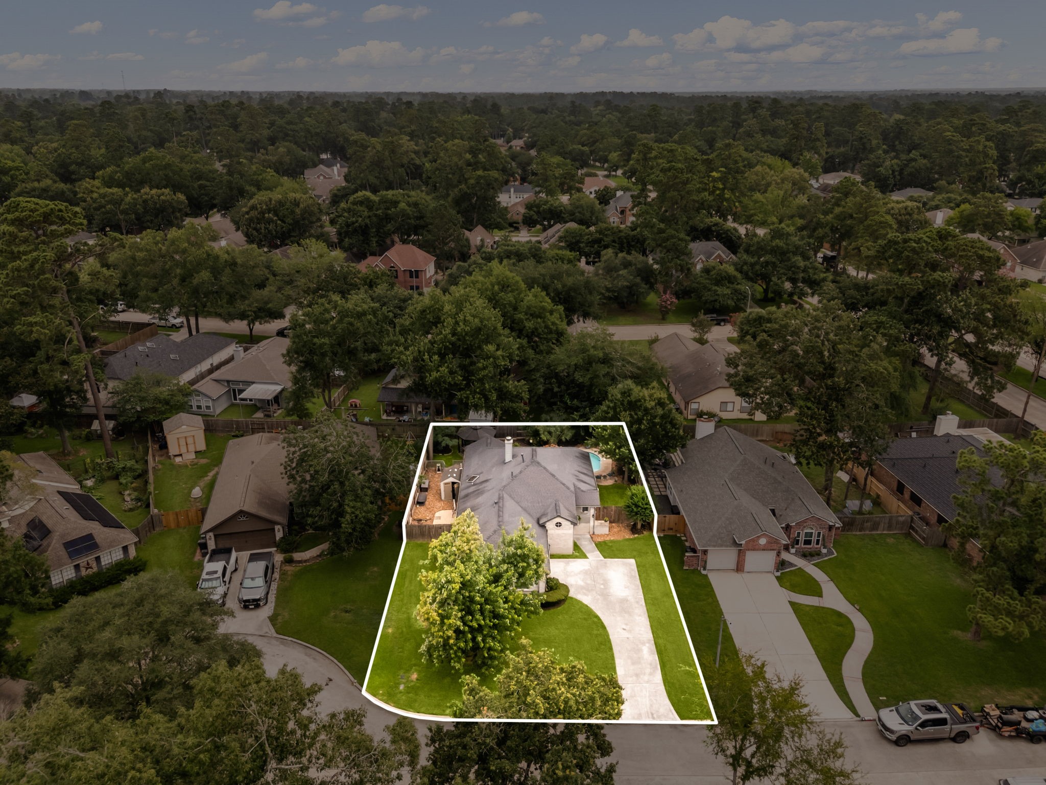 1915 Mercoal Drive Spring, TX 77386 - Photo 37 of 50 Drone view showcasing the property, spacious lot, and surrounding homes.
