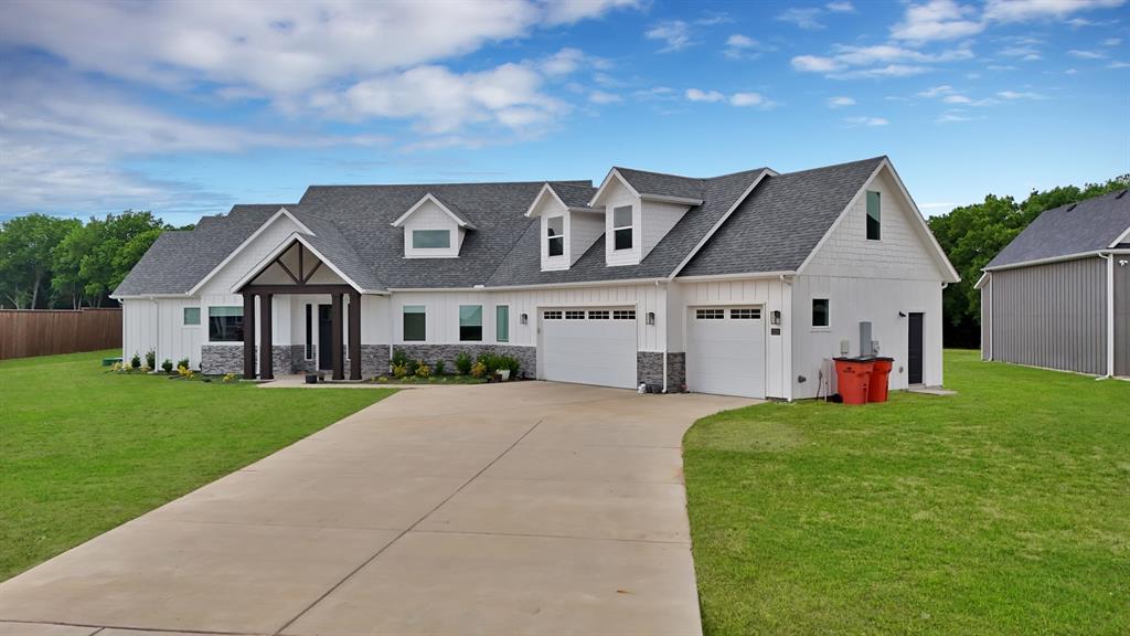 2223 Providence Way Nevada, TX 75173 - Photo 3 of 40 a front view of house with yard and green space