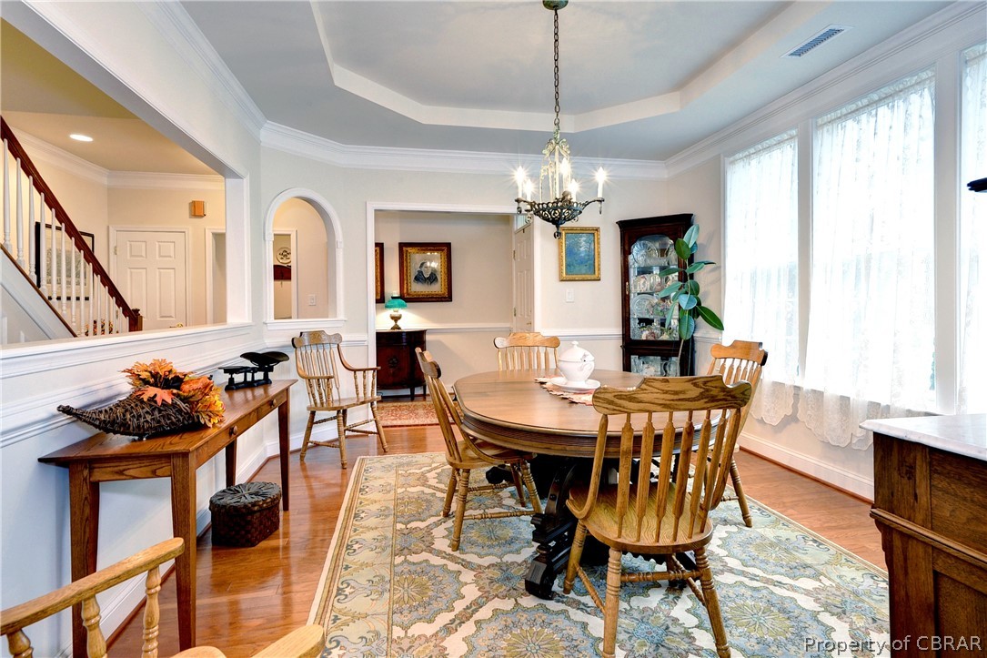 4220 Old Lock Road Williamsburg, VA 23188 - Photo 16 of 45 The dining room offers a tray ceiling and hardwood floors.