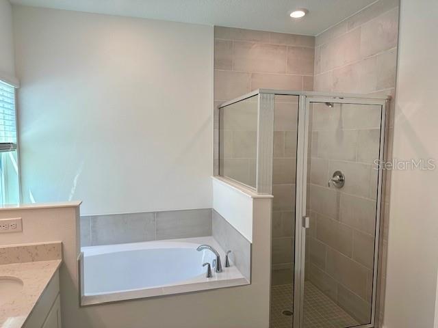 4511 Northwest 14th Loop Ocala, FL 34482 - Photo 12 of 27 a bathroom with a bathtub and a shower