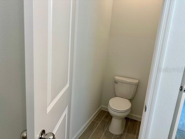 4511 Northwest 14th Loop Ocala, FL 34482 - Photo 13 of 27 a bathroom with a toilet
