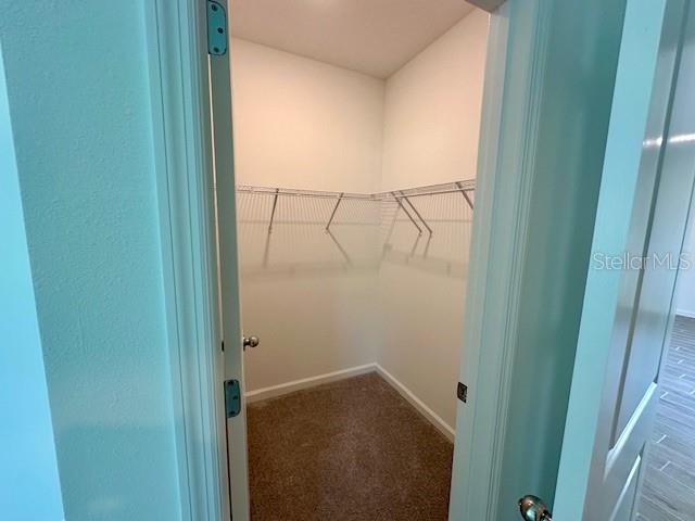 4511 Northwest 14th Loop Ocala, FL 34482 - Photo 15 of 27 a bathroom with a glass shower door