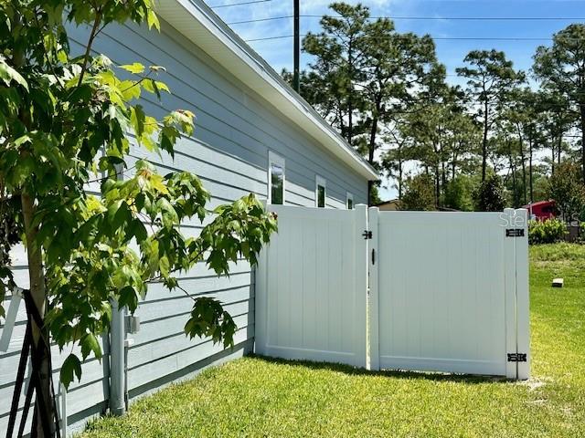 4511 Northwest 14th Loop Ocala, FL 34482 - Photo 18 of 27 a view of a backyard with plants