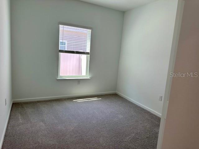 4511 Northwest 14th Loop Ocala, FL 34482 - Photo 21 of 27 an empty room with a window