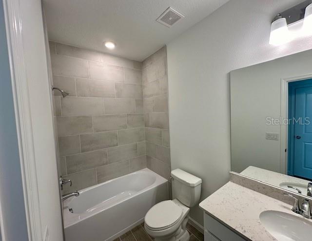 4511 Northwest 14th Loop Ocala, FL 34482 - Photo 22 of 27 a bathroom with a sink a toilet and shower