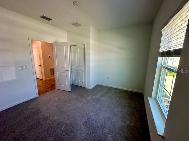 4511 Northwest 14th Loop Ocala, FL 34482 - Photo 23 of 27 an empty room with windows