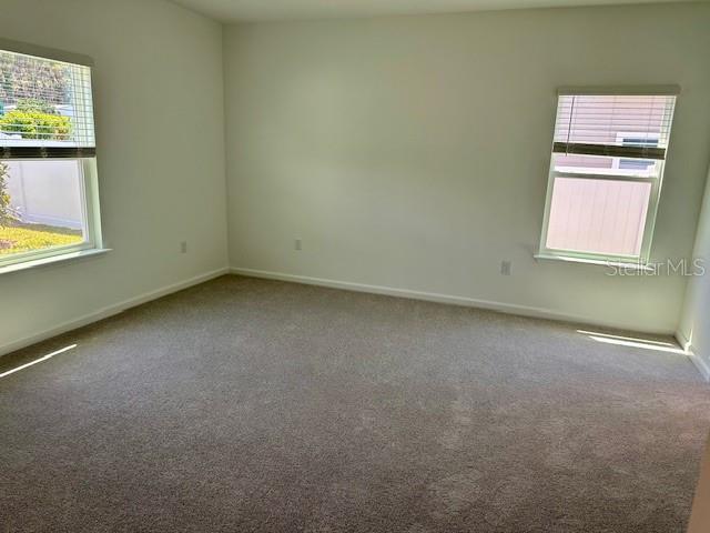 4511 Northwest 14th Loop Ocala, FL 34482 - Photo 9 of 27 an empty room with a window