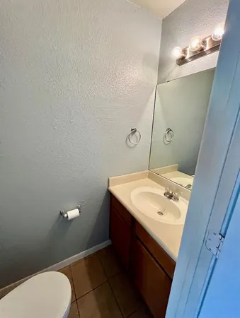a bathroom with a sink and mirror